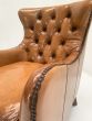 Button back armchairs