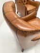 Button back high armchairs