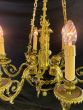 Stylish French gilded brass chandelier, supporting cherubs and 6 candles