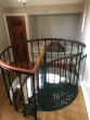 Original Victorian cast iron spiral staircase with intricate fleur de lys detailing