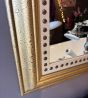 Stylish & studded gilt mirror