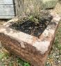 D shaped red sandstone planter trough