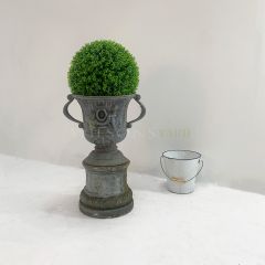 Lead urn on base with cherub detailing