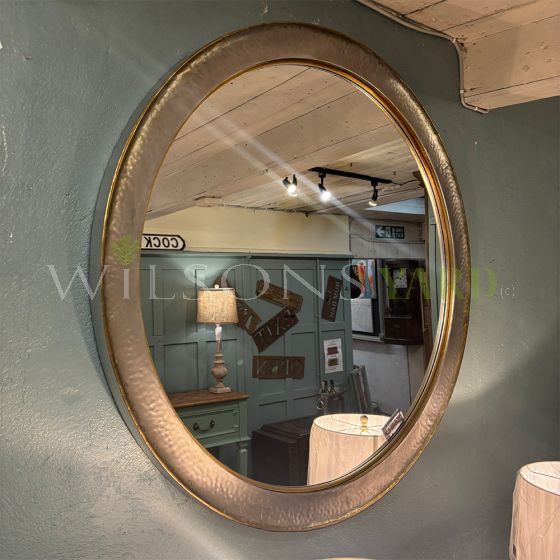 Large silvered circular mirror