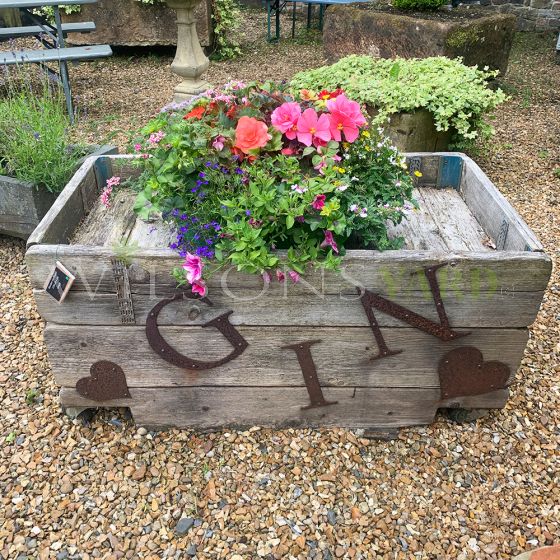 Wooden Gin metal sign garden planter on wheels 